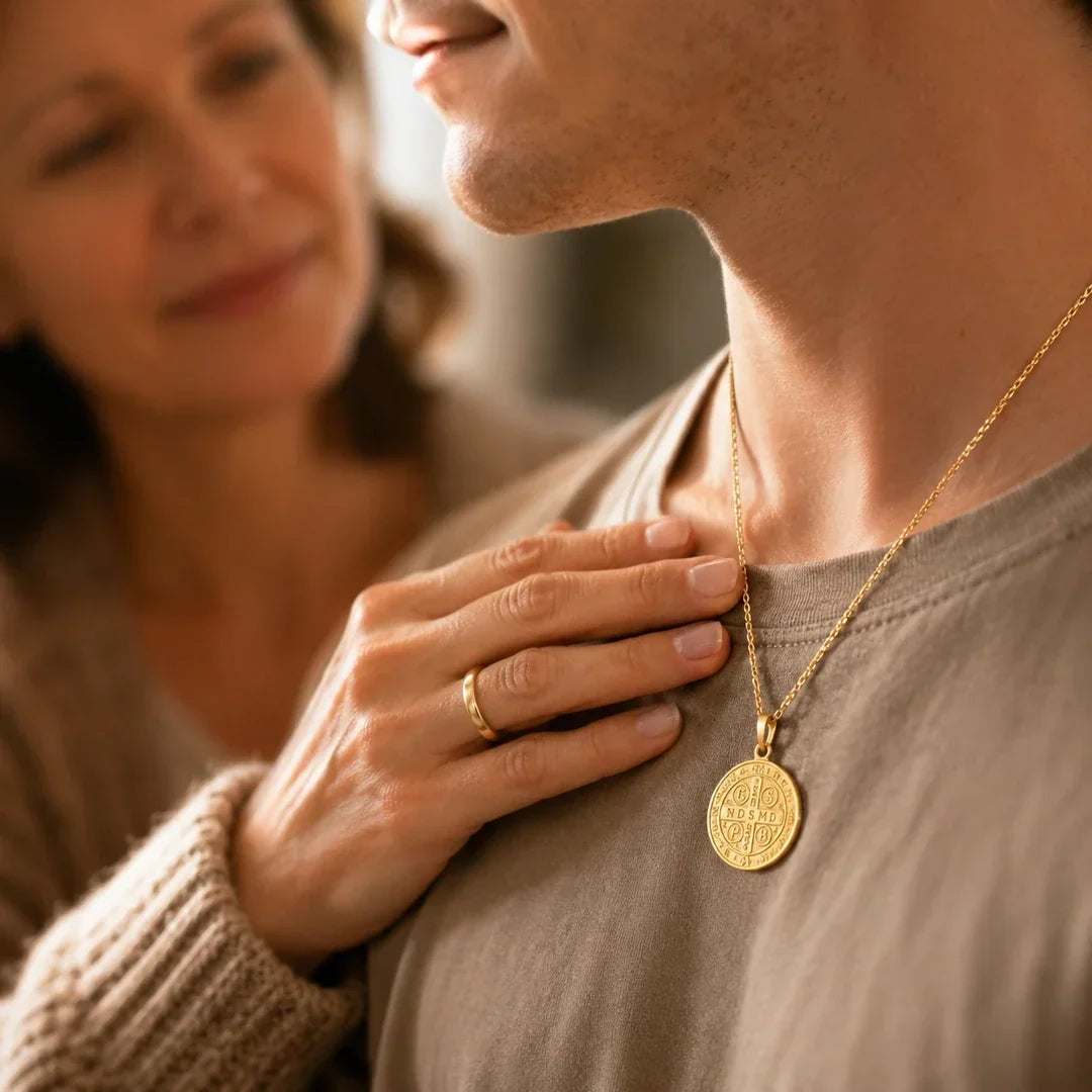 A mother's hand resting near her son's Guardian medal