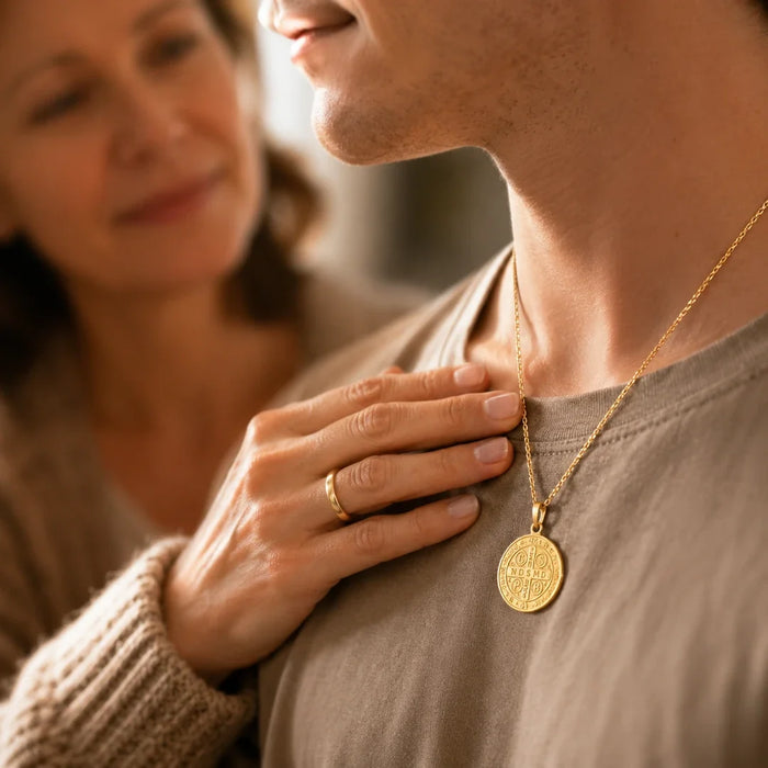 A mother's hand resting near her son's Guardian medal